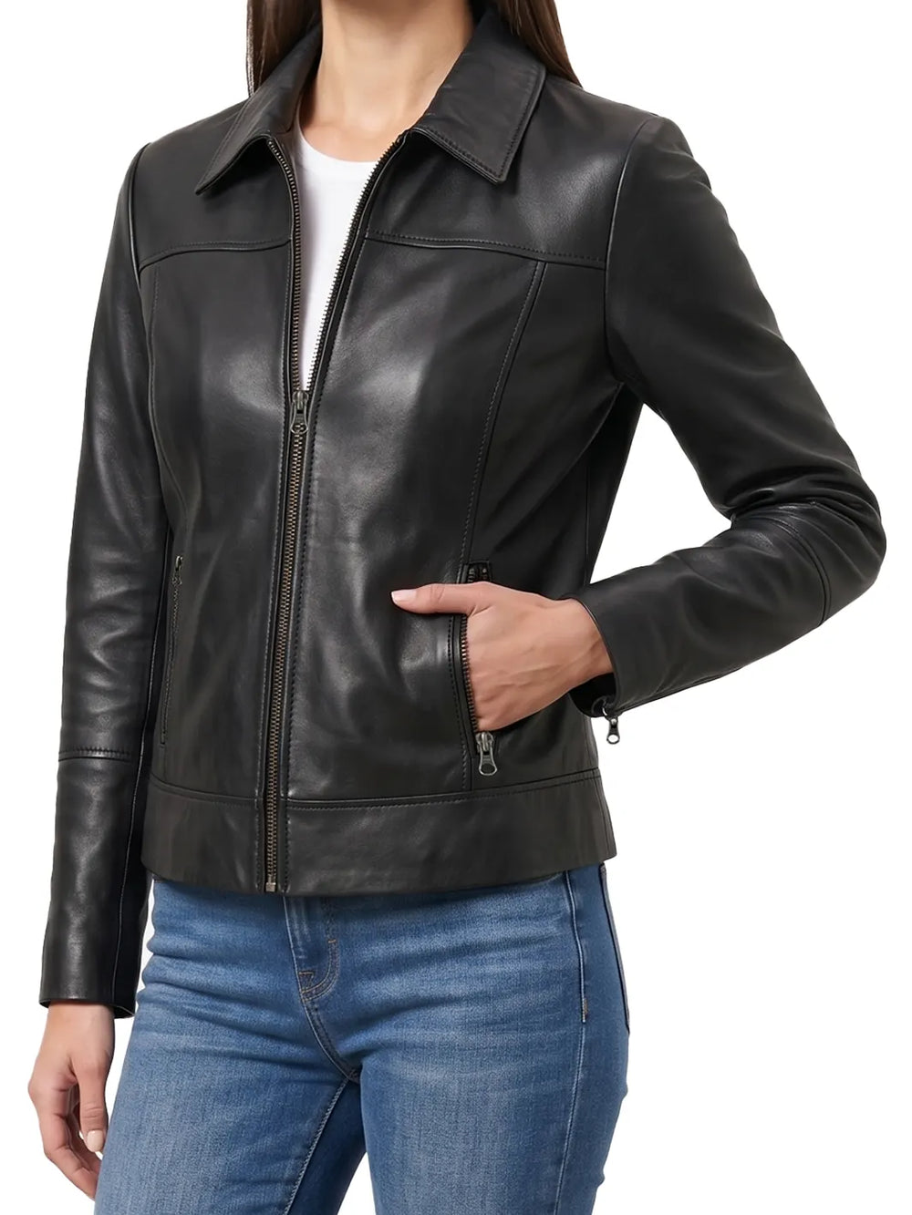 A woman wearing a black leather moto jacket with a front zipper, zippered hand pocket, and ribbed hem, paired with blue jeans against a white background.