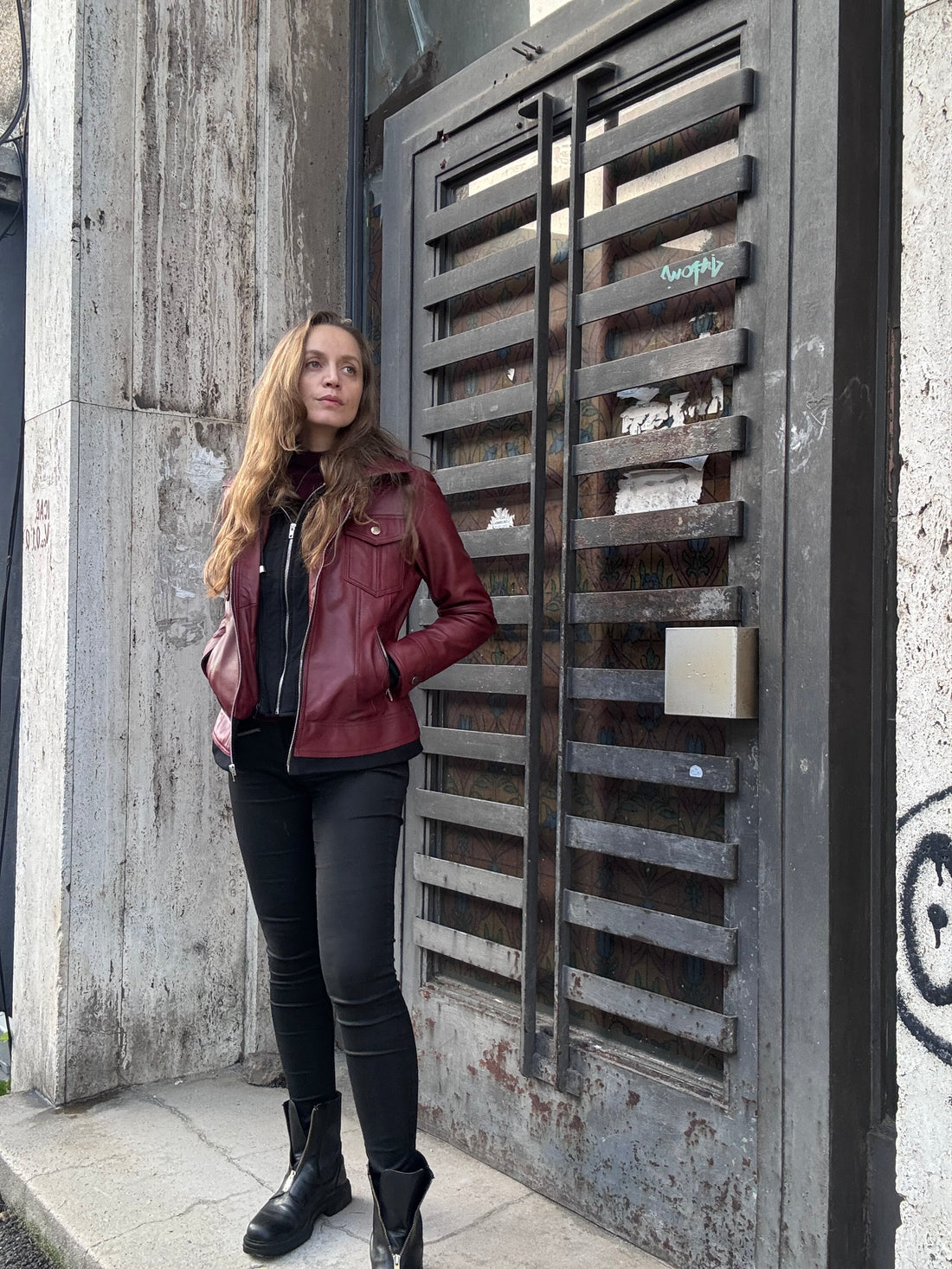 Burgundy real leather jacket in soft evening light